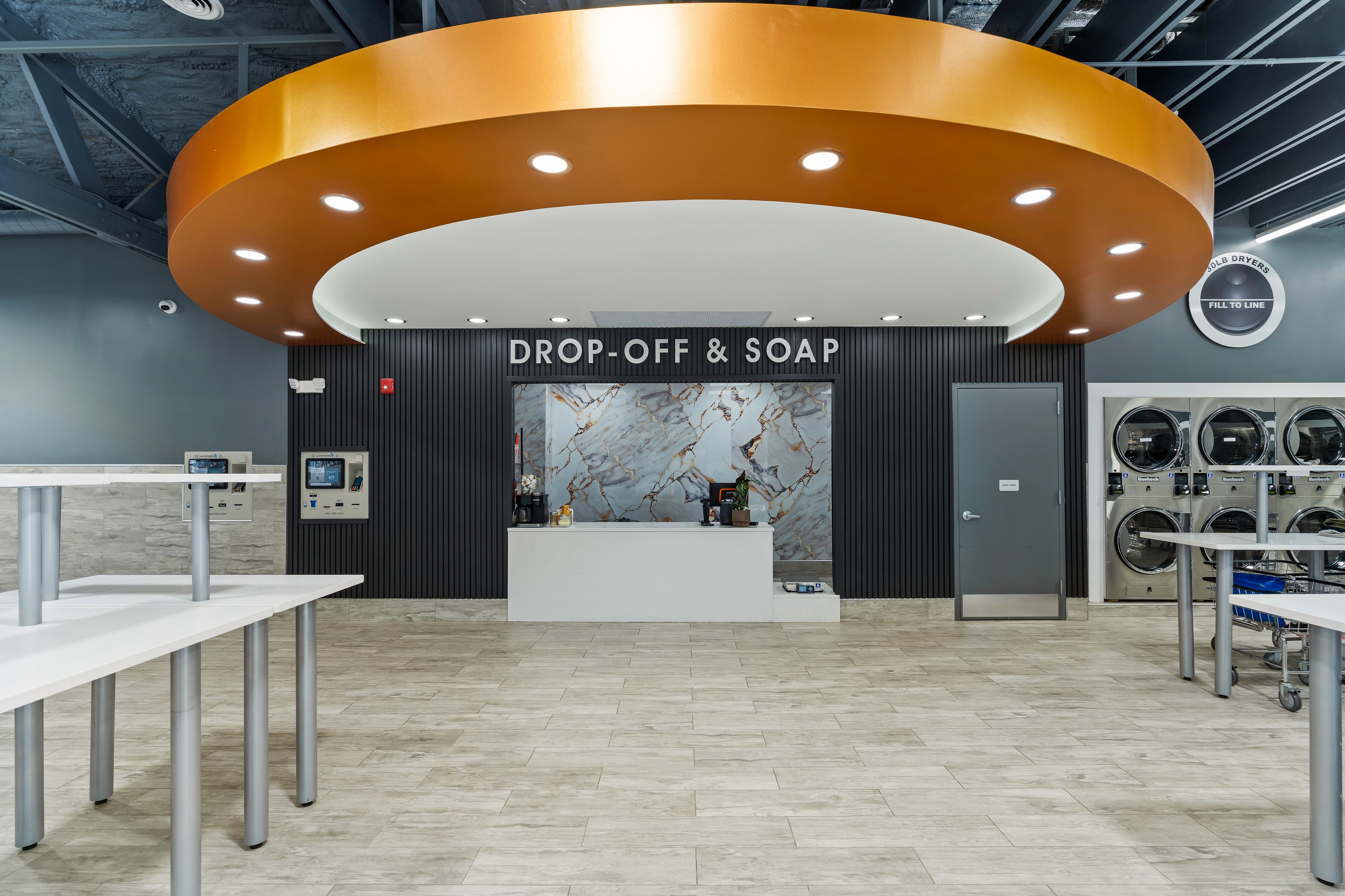 Folding tables and machines inside Fresh Wash West Orange